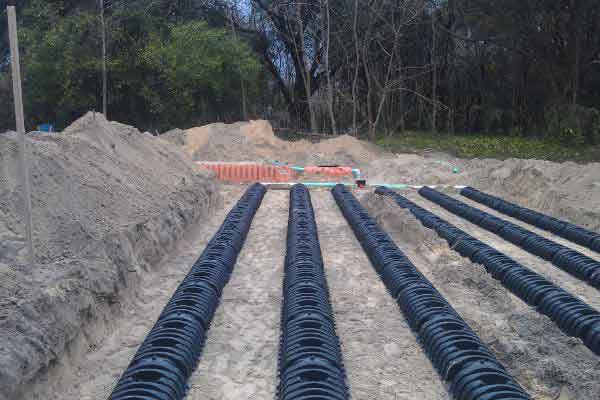 It’s a drain field with pipes being laid for underground installation